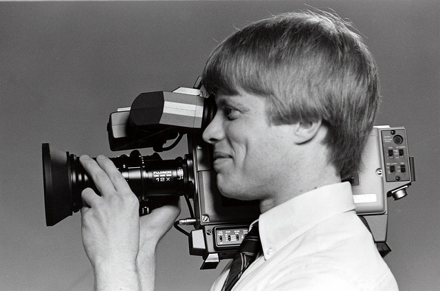 man with video camera online video marketing