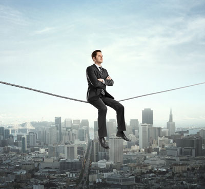 business-man-tightrope social media risks